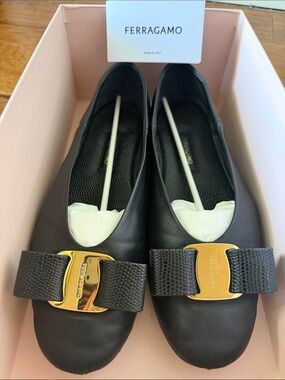 Salvatore Ferragamo Black Leather Vara Bow Flats, Gold hardware. Box, dust bags.